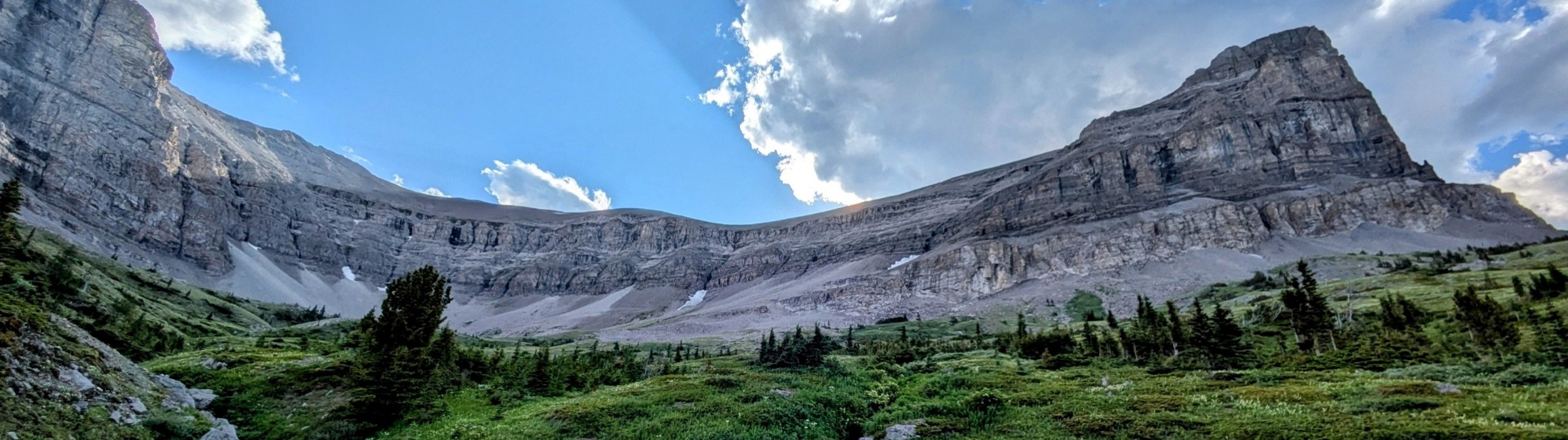 beehive mountains with a partially cloudy sky