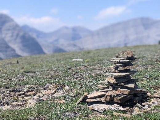 A cairn on top of a mountain pass