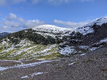 A mountain dusted with fresh snow in the spring