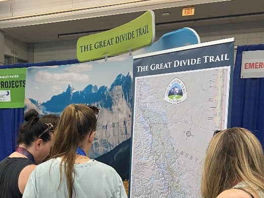 People checking out the GDTA event booth